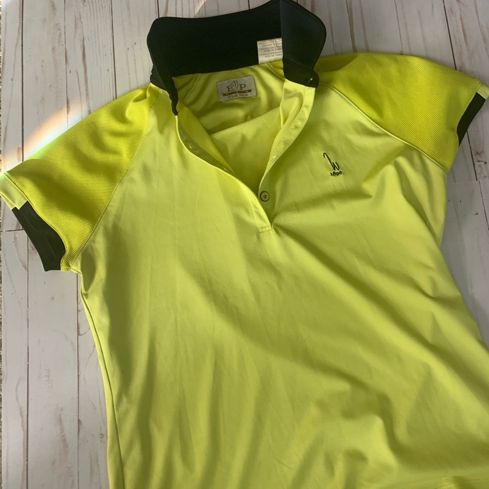 Bright yellow with black trip lady’s golf top